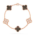 https://cdn.shopify.com/s/files/1/0679/7780/6117/files/VintageAlhambrabracelet_5motifsblackmopdiamond.jpg?v=1727641923