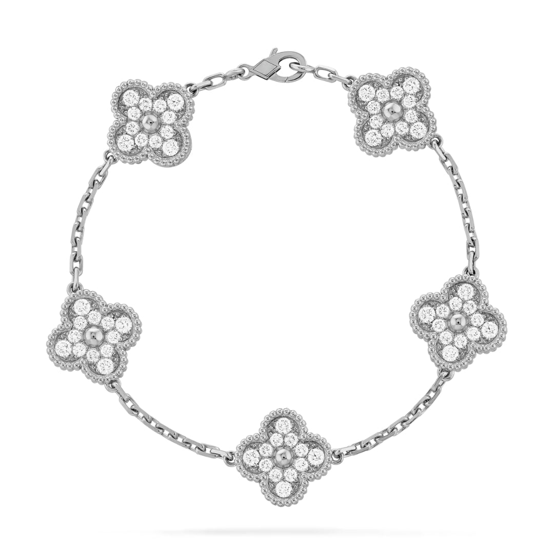 https://cdn.shopify.com/s/files/1/0679/7780/6117/files/VintageAlhambrabracelet_5motifsdiamondswhitegoldfull.jpg?v=1727697584